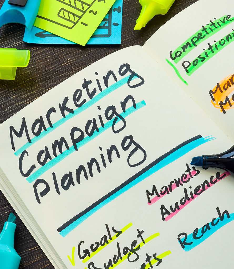 Book labeled Marketing Campaign Planning