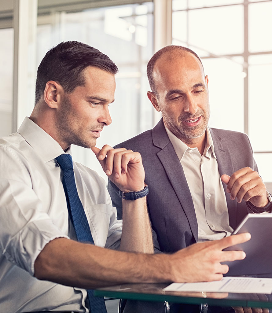 Two businessmen viewing a tablet